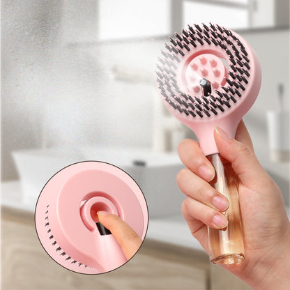 Hand pressing the spray button on the Pink MistBrush FE1004